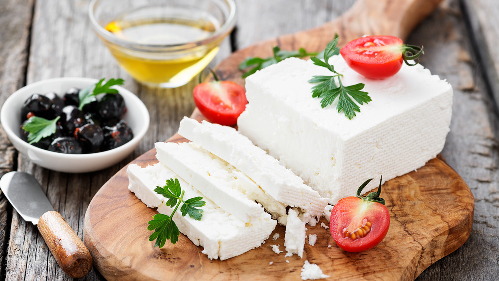 Block of feta with olives and tomatoes