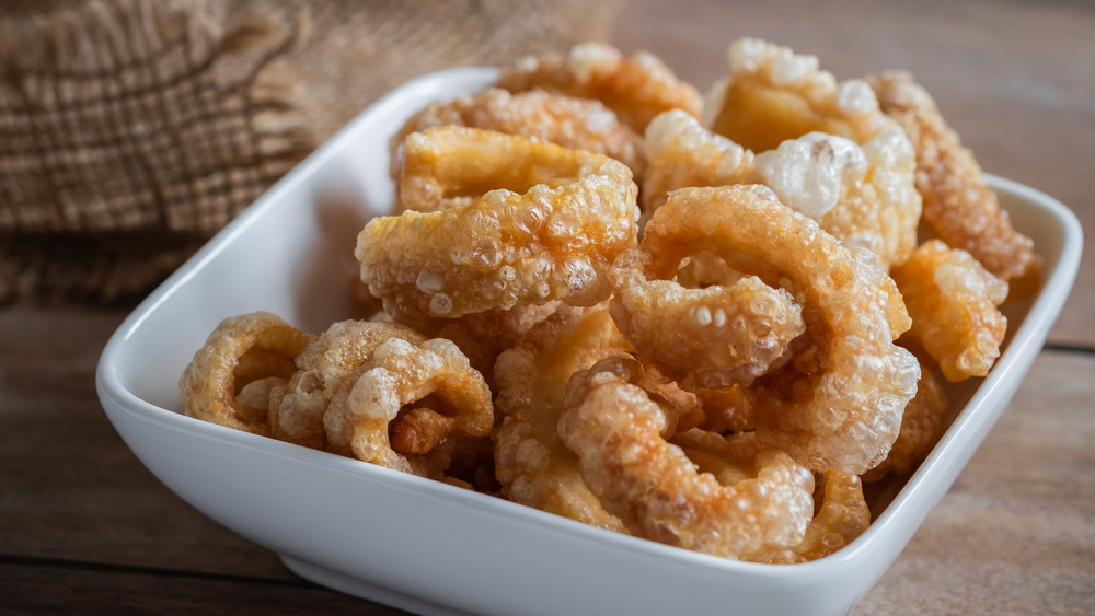 Pork rinds in a white bowl