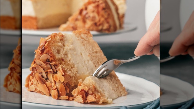 Fork cutting into a slice of Bee Sting Cake