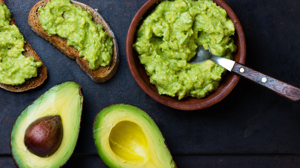 Bowl of guacamole with avocados