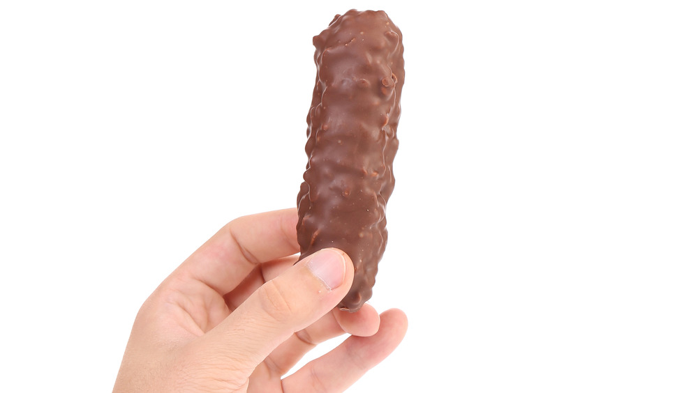 Hand holding chocolate wafer bar