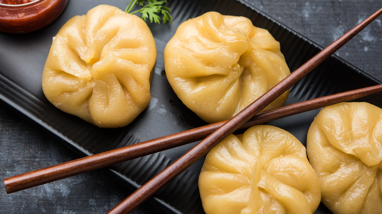 Dumplings on a black tray