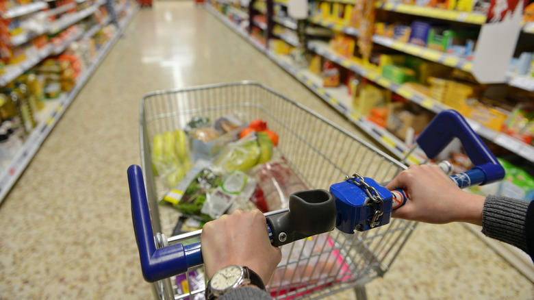 Aldi cart on a beige aisle