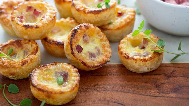 Small quiches on brown wood