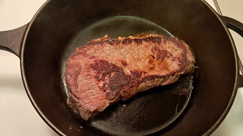 Top sirloin steak in pan