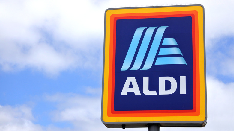 Aldi store sign with clouds