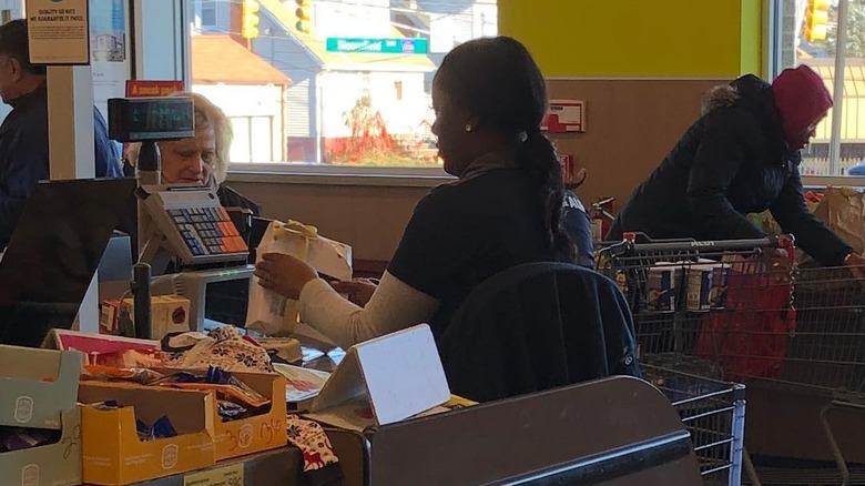 Seated cashier at Aldi