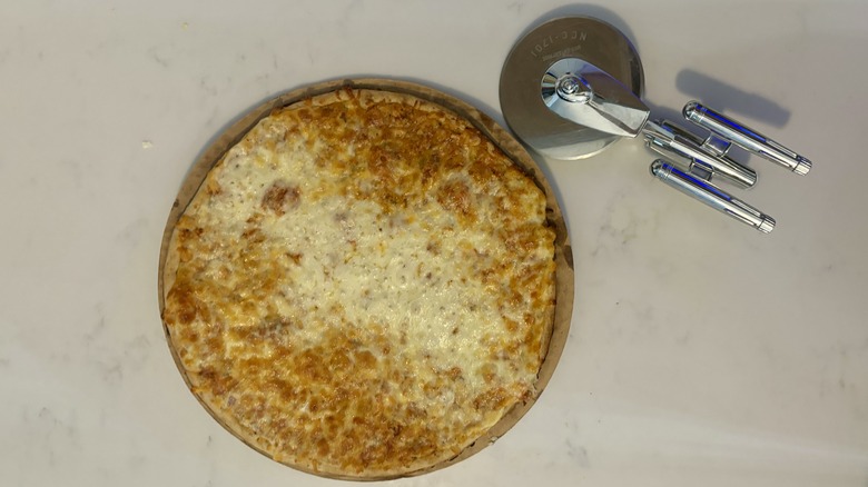 cheese pizza and pizza cutter