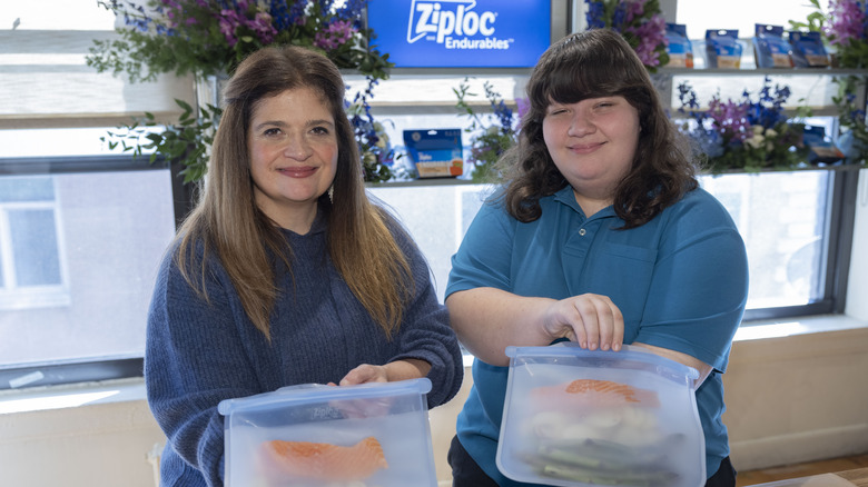 Alex Guarnaschelli and daughter Ava holding bags