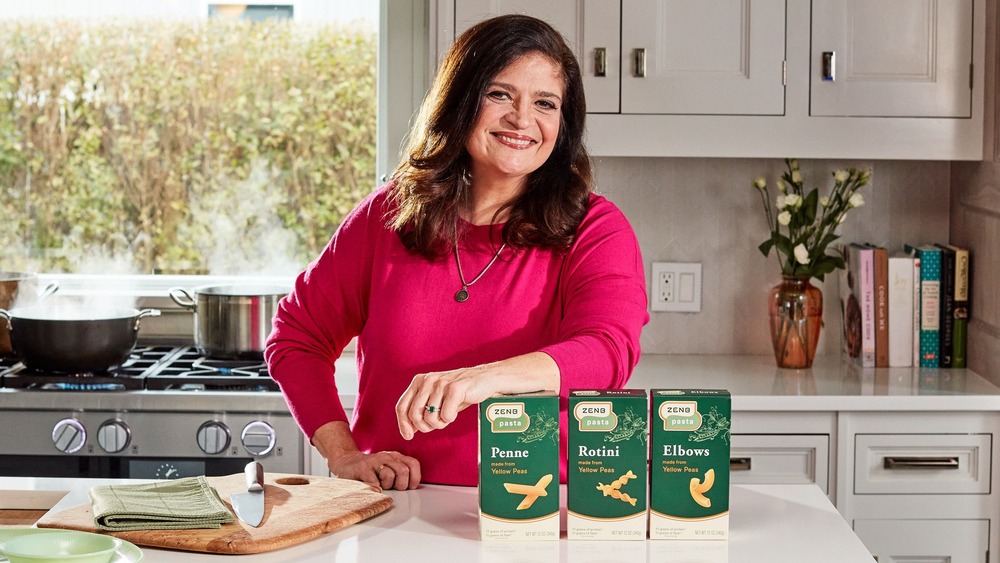 Alex Guarnaschelli standing at the counter with ZENB pastas