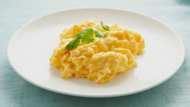 white plate with scrambled eggs