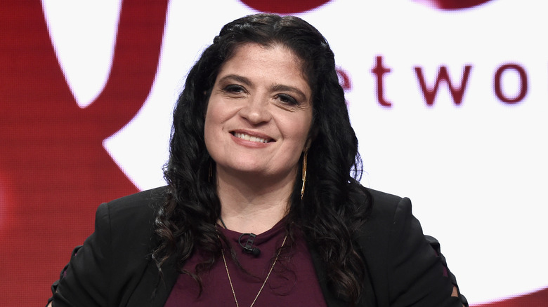 Alex Guarnaschelli smiling in a candid photo