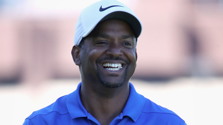 Alfonso Ribeiro smiling on the golf course