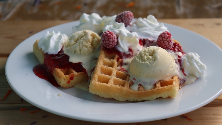 waffle with raspberries and ice cream