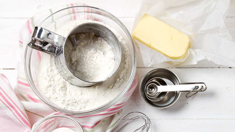 flour sifter, butter, measuring cups