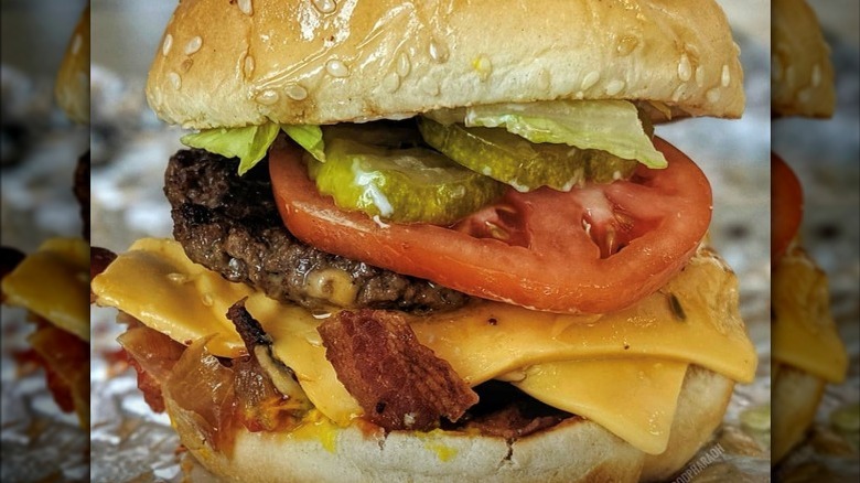 large burger stuffed with toppings