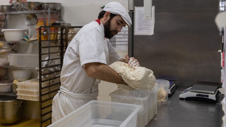 Man needing dough in factory