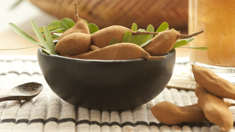 Bowl of tamarind fruit pods