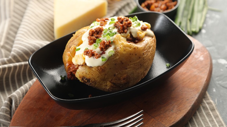 twice baked potato in black dish