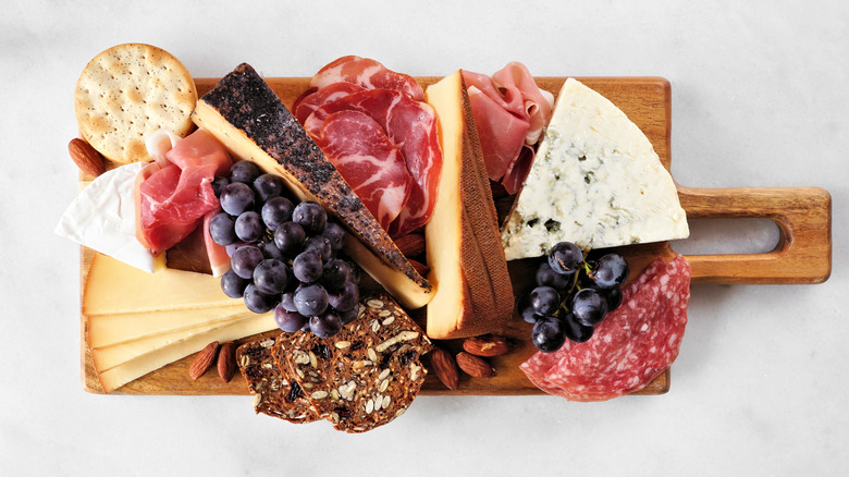 Meats and cheeses on serving board