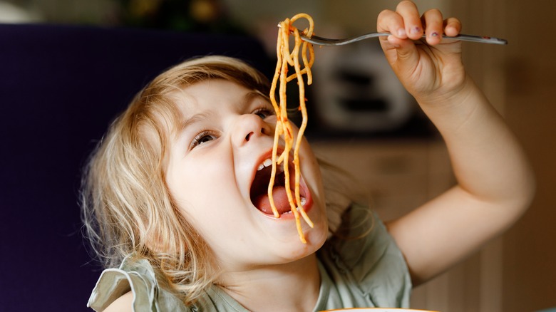 Child eating pasta