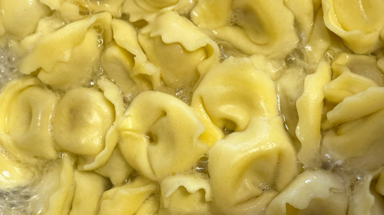 Tortellini cooking in boiling water