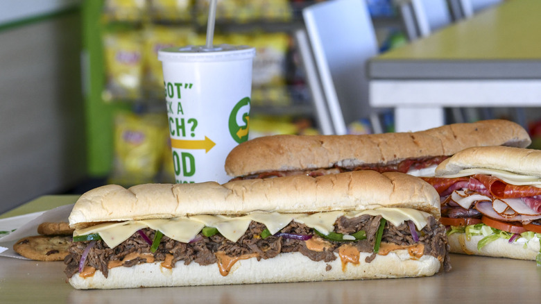 Subway steak and cheese sub on a restaurant counter