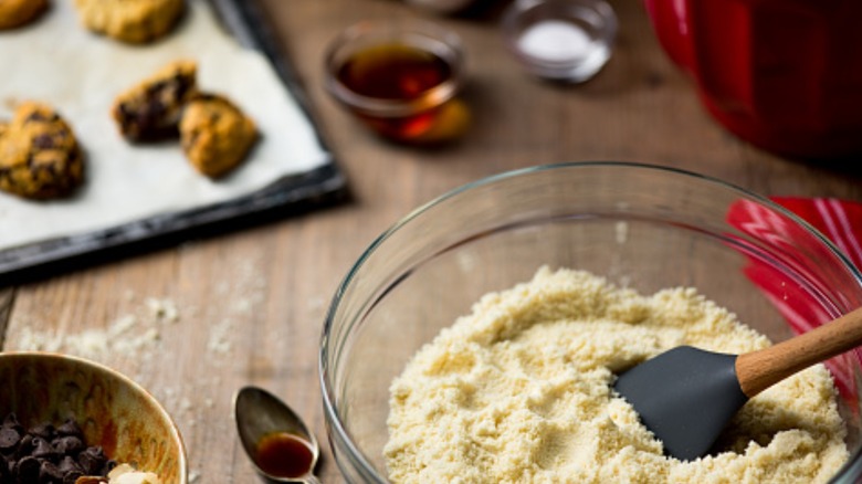 bowl of almond flour with cookie dough and vanilla