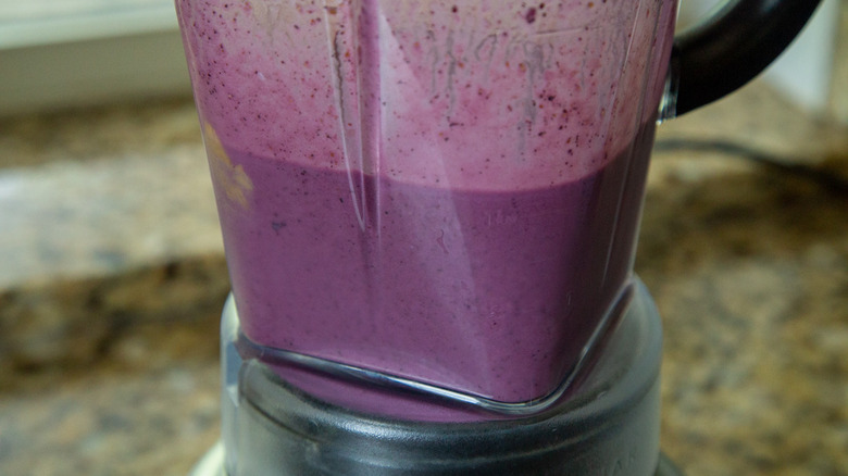 blended blueberry smoothie in blender