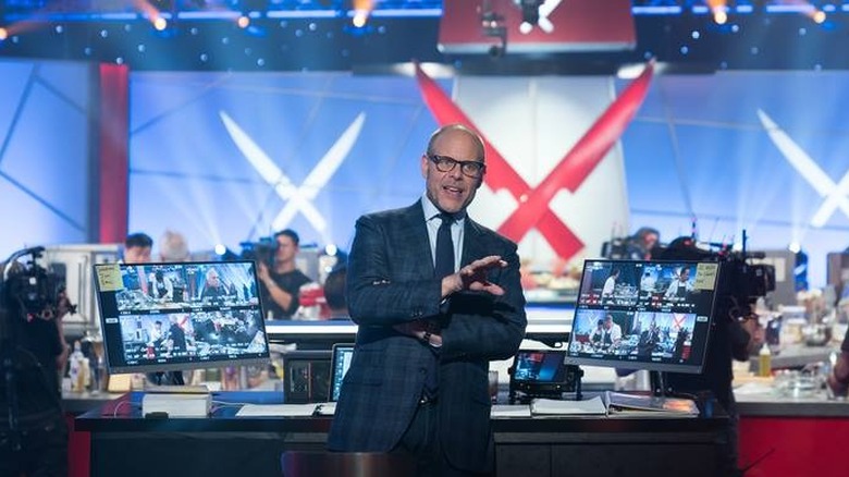 Iron Chef host Alton Brown prepares on set