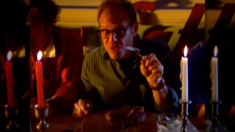 Alton Brown pointing fork