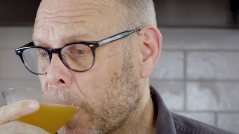 Alton Brown sipping martini