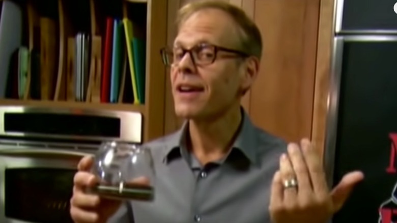 Alton Brown holding coffee pot