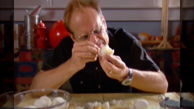 Alton Brown inspecting boiled eggs