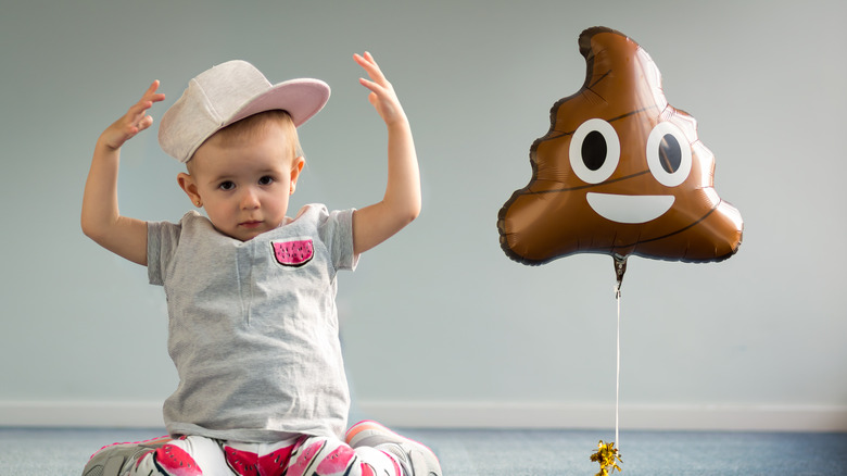 Small child with poop baloon