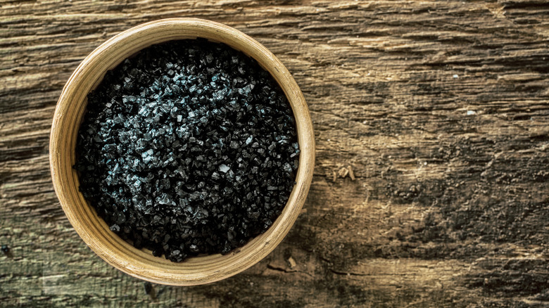 Small bowl of black lava sea salt