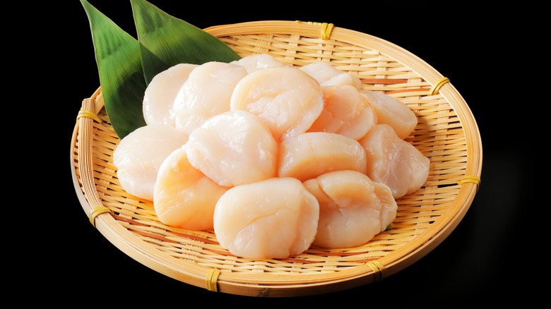 Scallops in bamboo colander