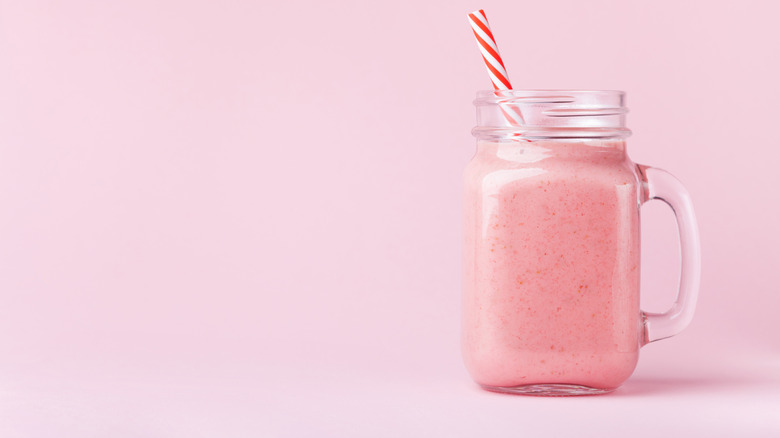 Pink smoothie in mason jar