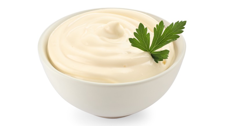 Homemade mayonnaise in white bowl