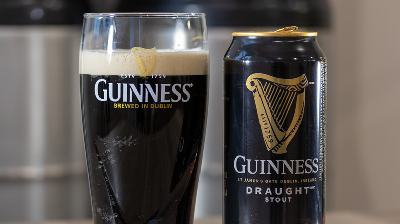 A can and pint glass of Guinness stout