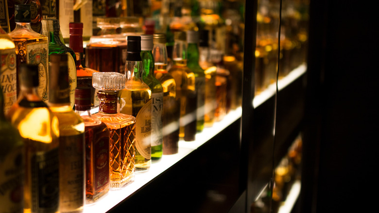 alcohol cabinet with assorted bottles