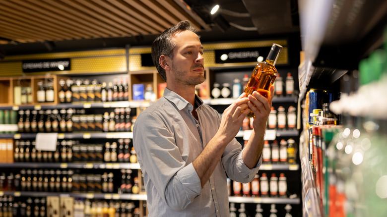 man browsing in liquor store