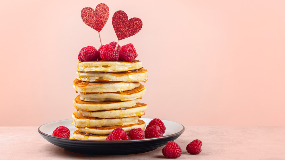 stack of pancakes with raspberries