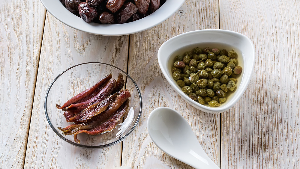 Capers and anchovies and olives