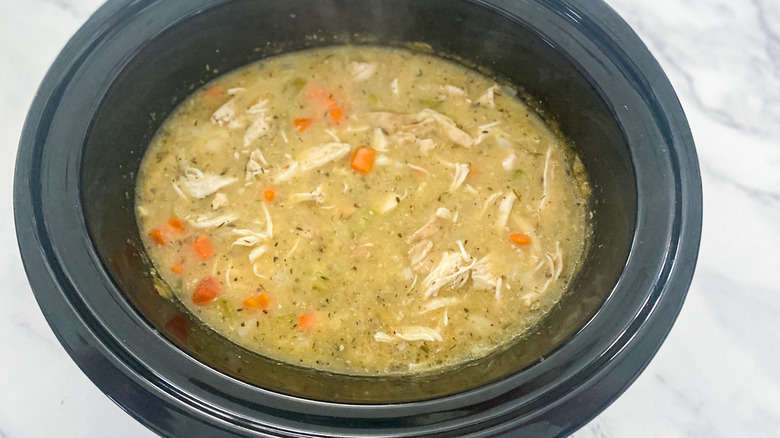 shredded chicken and dumplings in a slow cooker