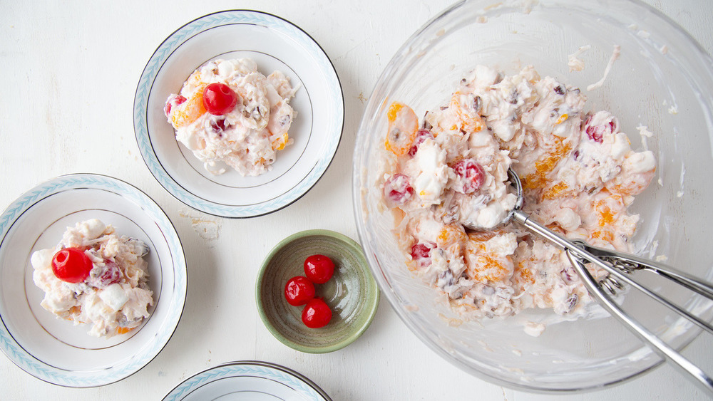 Old fashioned ambrosia in bowls with cherry garnish