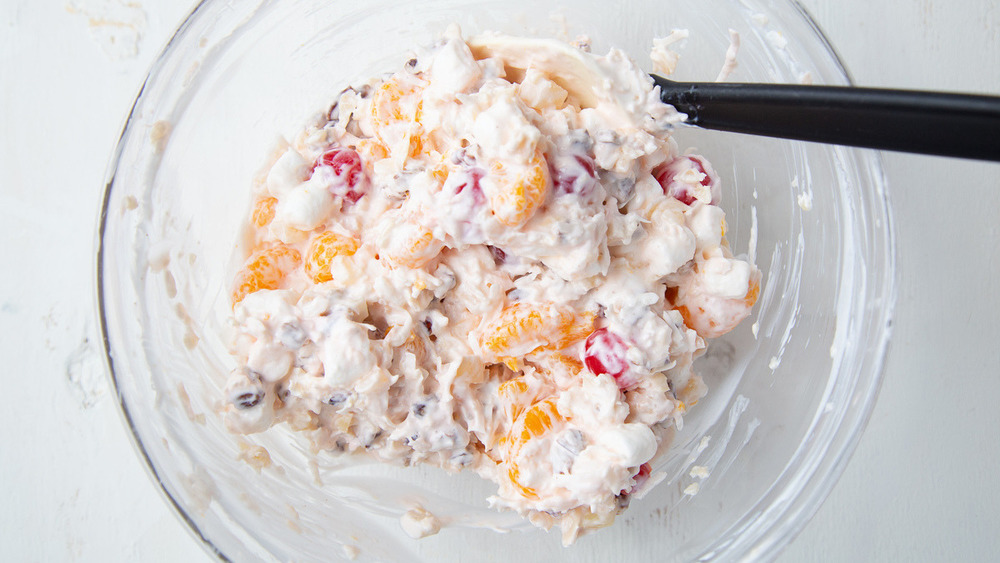 Fruit and sour cream in a bowl for ambrosia recipe