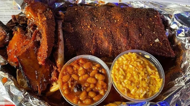 Charlie Vergos Rendezvous ribs on a tray with sides
