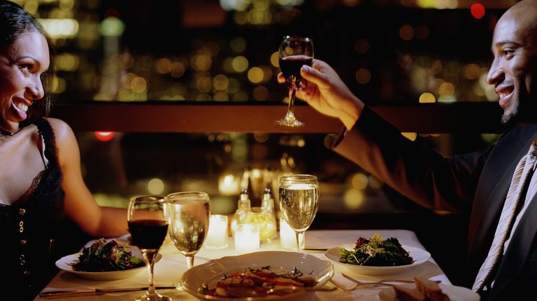 Couple dining by candlelight at a restaurant  