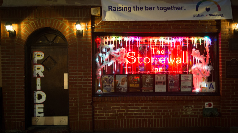 Exterior of Stonewall Inn with large "Pride" sign 